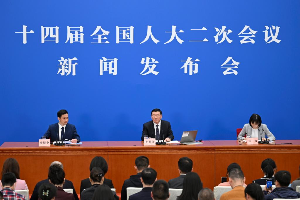3月4日，十四屆全國人大二次會議在北京人民大會堂舉行新聞發(fā)布會。大會發(fā)言人婁勤儉就大會議程和人大工作相關(guān)問題回答中外記者的提問。 新華社記者 牟宇 攝